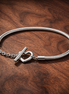 Pandora Moments Heart T-Bar Snake Chain Bracelet — display on walnut