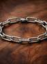 Pandora ME Medium-Link Chain Bracelet — display on walnut
