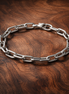 Five Openable Link Chain Bracelet — display on walnut