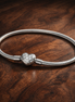 Pandora Sterling Silver Lab-grown Diamond Heart Clasp Snake Chain Bracelet — display on walnut