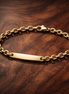 Engravable Bar Link Bracelet — display on walnut