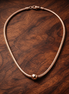 Pandora Moments Snake Chain Necklace — display on walnut