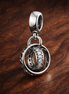 Interlocking Rings - Sterling Silver Interlocking Rings Dangle Charm With Sparkling Stones — display on walnut