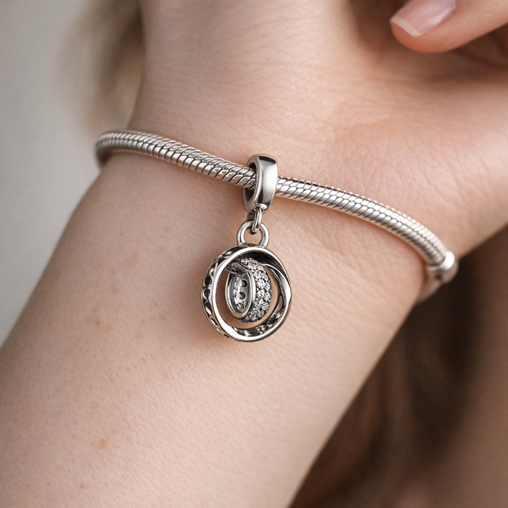 Interlocking Rings - Sterling Silver Interlocking Rings Dangle Charm With Sparkling Stones — worn on wrist