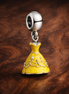 Yellow Princess Dress Charm - Yellow Storybook Princess Dress Charm — display on walnut