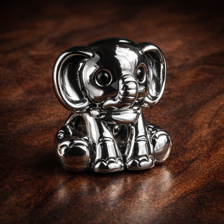 Ellie the Elephant Charm — display on walnut