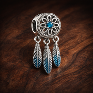 Blue Dreamcatcher Charm - Blue Feather Dreamcatcher Charm — display on walnut