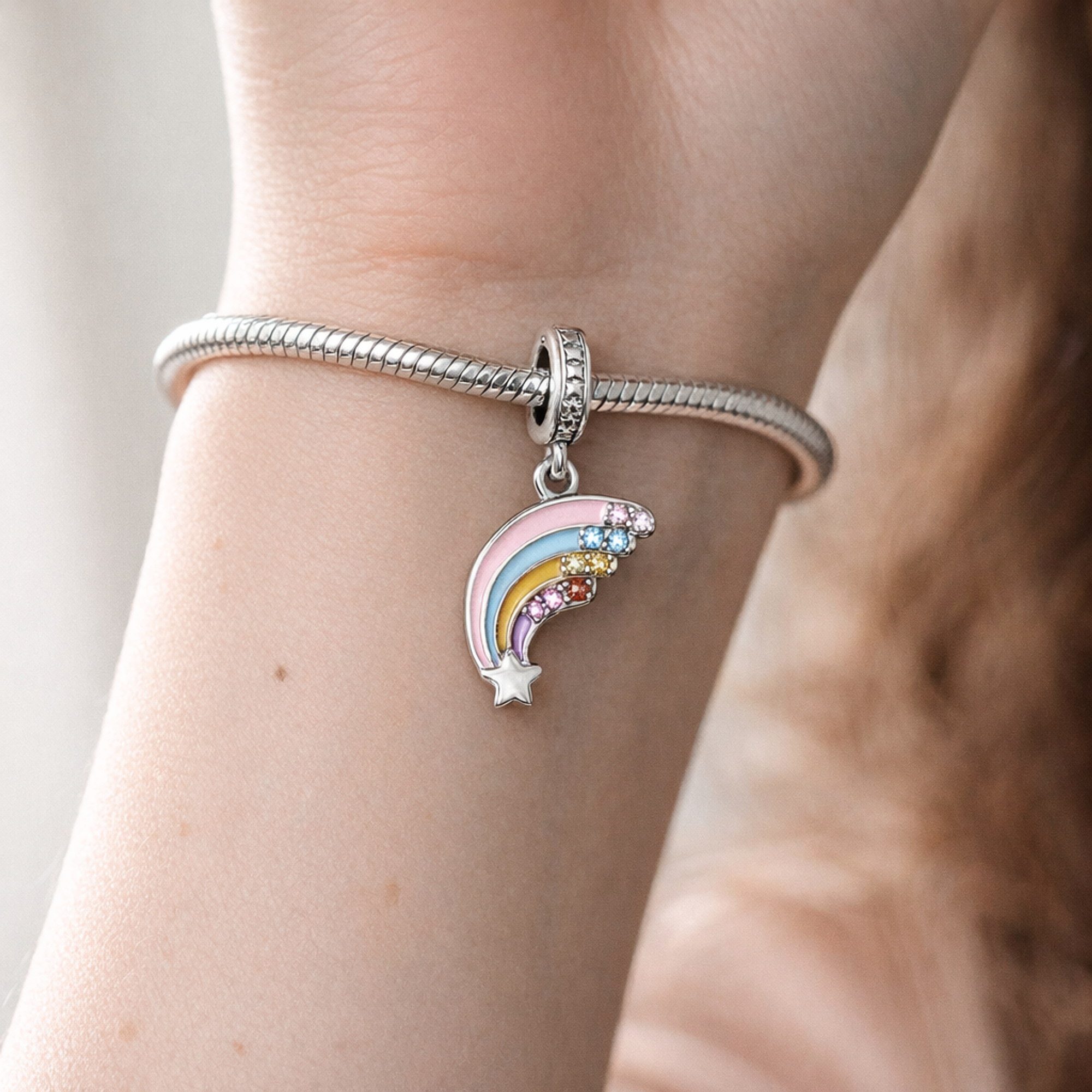 Pastel Rainbow Dangle - Pastel Rainbow Cloud Charm — worn on wrist