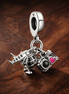 Airplane, Globe & Suitcase Dangle Charm — display on walnut