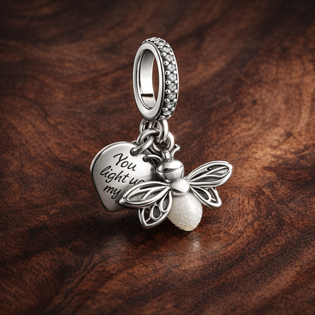 Glow-in-the-dark Firefly Dangle Charm — display on walnut