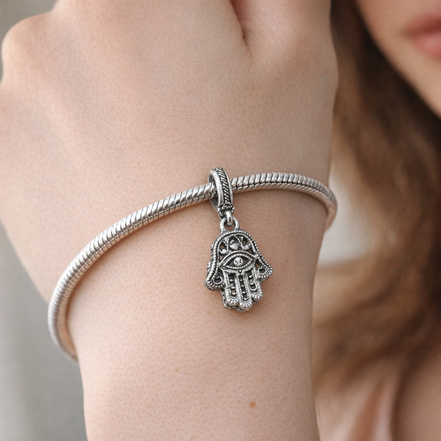 Protective Hamsa Hand Dangle Charm — worn on wrist