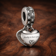 Lucky Heart Charm - Silver Lucky Heart Dangle Charm — display on walnut