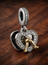 Two-tone Happy Anniversary Dangle Charm — display on walnut