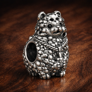 Textured Hedgehog Charm - Silver Hedgehog Woodland Bead — display on walnut