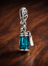 Blue Perfume Bottle Charm - Teal Perfume Bottle Dangle Charm — display on walnut