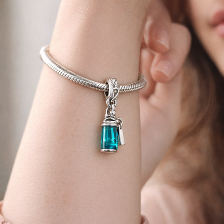 Blue Perfume Bottle Charm - Teal Perfume Bottle Dangle Charm — worn on wrist
