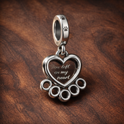 Hearts & Paw Print Dangle Charm — display on walnut
