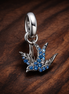 Blue Bird Charm - Silver Bird with Blue Crystal Charm — display on walnut