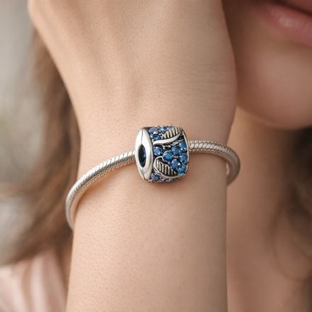 Curved Feather & Pavé Clip Charm — worn on wrist