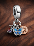Tea Time Butterfly Charm - Tea Time and Butterfly Dangle Charm — display on walnut