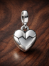 Silver Faceted Heart Charm - Silver Faceted Heart Dangle Charm — display on walnut