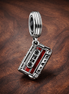 Movie Ticket Charm - Red Movie Ticket Dangle Charm — display on walnut