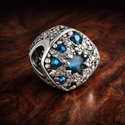 Blue Starburst Bead - Navy Starburst Crystal Bead — display on walnut