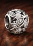 Leaf Vine Bead - Silver Leaf Vine Openwork Bead — display on walnut