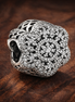 Clear Floral Cluster Bead - Clear Floral Cluster Sparkle Bead — display on walnut