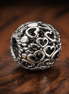 Black Pandora Heart Bead - Black and Silver Heart Logo Charm — display on walnut