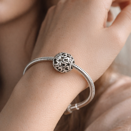 Black Pandora Heart Bead - Black and Silver Heart Logo Charm — worn on wrist