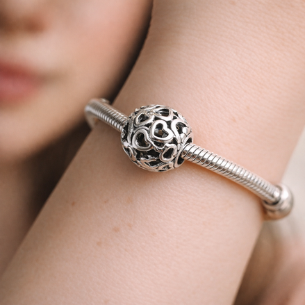 Silver Love Knot Bead - Silver Open Love Knot Charm — worn on wrist
