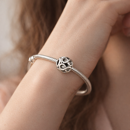 Silver Infinity Knot Bead - Silver Infinity Loop Charm — worn on wrist