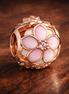 Pink Flower Enamel Bead - Pink Flower Enamel Charm — display on walnut