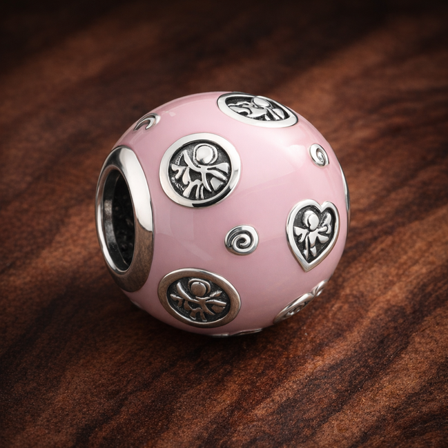 Pink Travel Patch Bead - Pink Travel Patch Charm — display on walnut