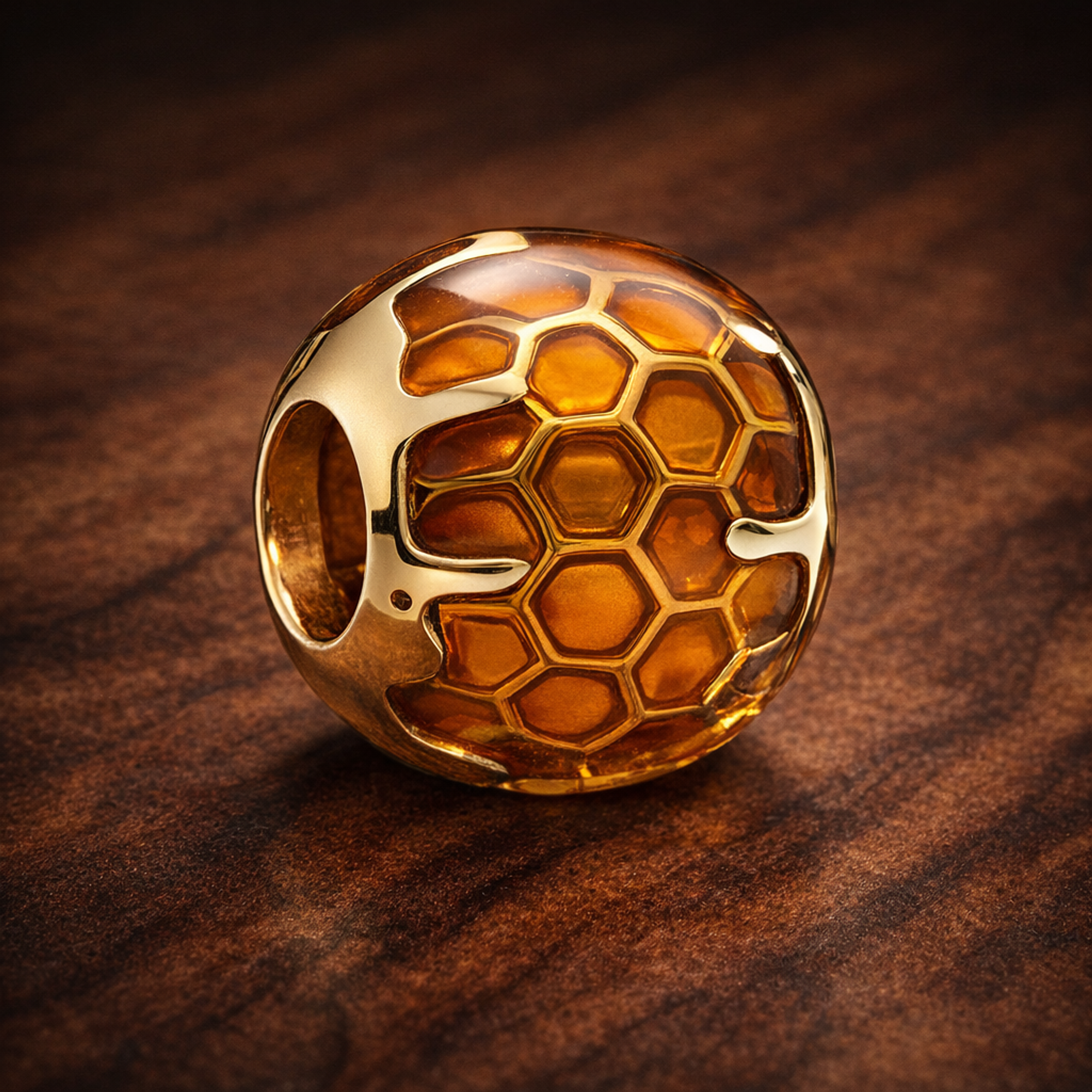 Amber Honeycomb Bead - Amber Honeycomb Enamel Charm — display on walnut