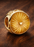 Golden Sunburst Heart Bead - Gold Plated Sunburst Heart Charm — display on walnut