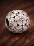 Pink Heart Cluster Bead - Pink Heart Cluster Charm — display on walnut