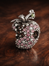 Pink Strawberry Charm - Pink Crystal Strawberry Charm — display on walnut