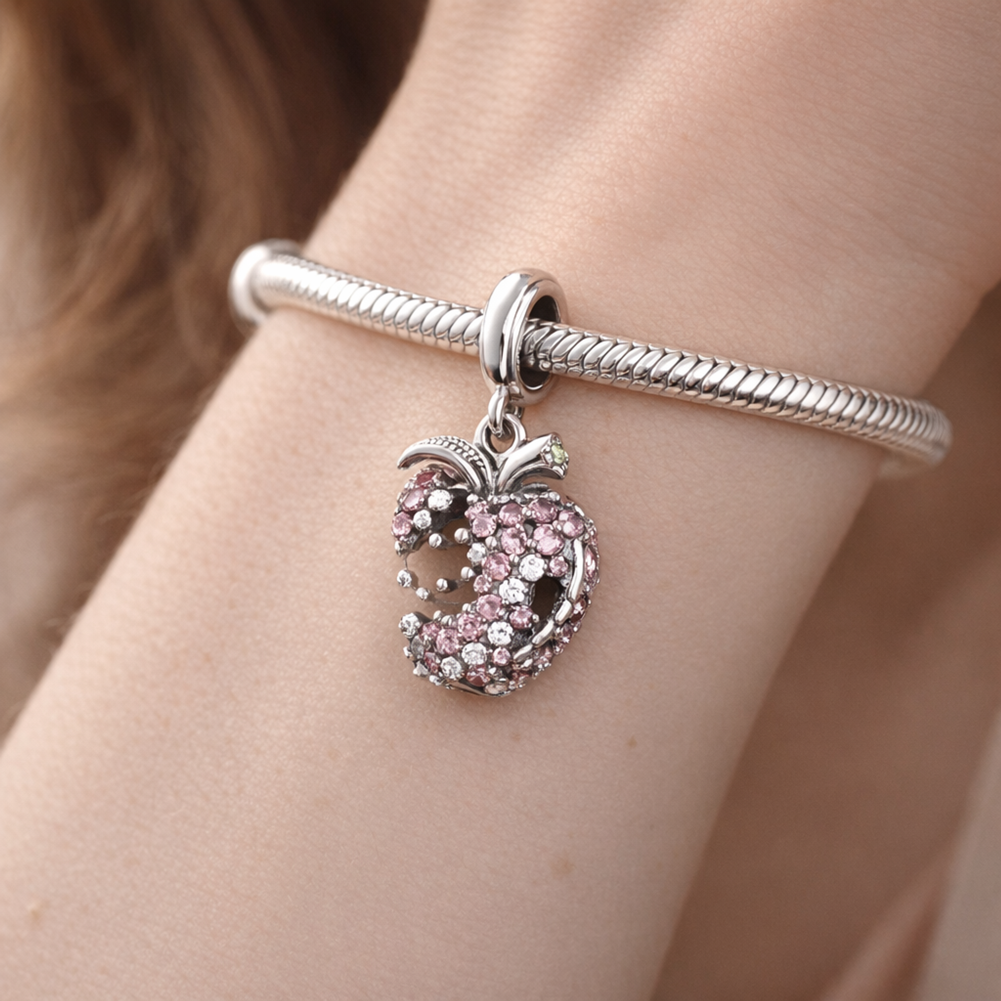 Pink Strawberry Charm - Pink Crystal Strawberry Charm — worn on wrist