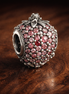 Pink Strawberry Charm - Pink Strawberry Sparkle Charm — display on walnut