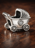 Baby Carriage Charm - Silver Baby Carriage Charm — display on walnut
