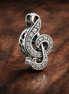 Treble Clef Charm - Silver Treble Clef Music Charm — display on walnut