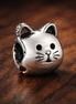 Cat Face Charm - Silver Cat Face Charm — display on walnut