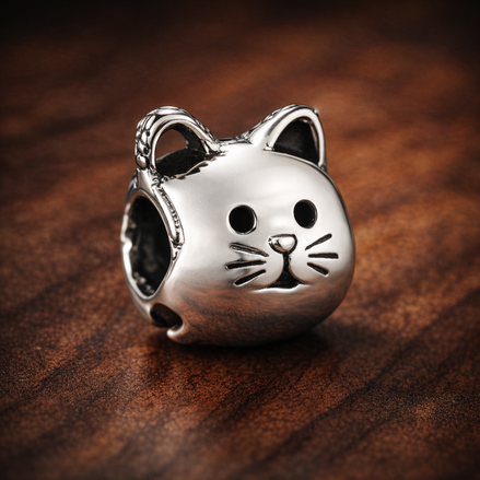 Cat Face Charm - Silver Cat Face Charm — display on walnut