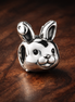 Bunny Face Charm - Silver Bunny Face Charm — display on walnut