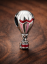 Red Hot Air Balloon Charm - Red and White Hot Air Balloon Charm — display on walnut