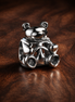 Toy Robot Charm - Smiling Toy Robot Charm — display on walnut