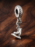 Figure Skate Charm - Ice Skate Dangle Charm — display on walnut