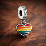 Rainbow Heart Charm - Rainbow Pride Heart Dangle Charm — display on walnut